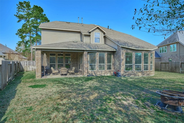120 Shane St, Montgomery, TX 77316 - back of property with an outdoor fire pit, a patio area, brick siding, and ceiling fan