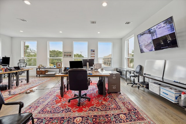 office space with wood finished floors, visible vents, and recessed lighting