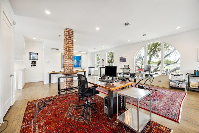 office space with recessed lighting, wood-type flooring, visible vents, and baseboards