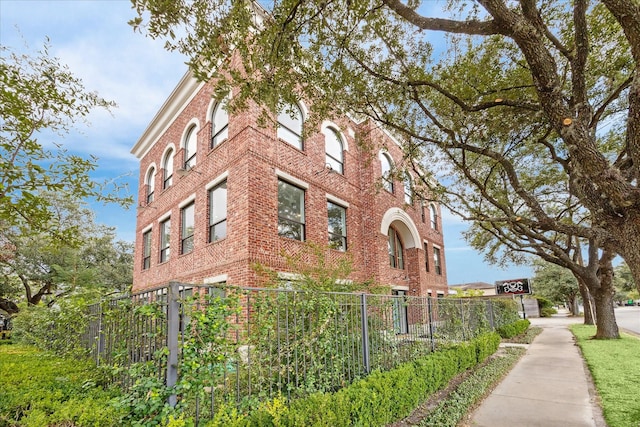 view of property featuring fence