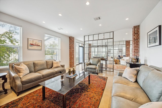 living room with recessed lighting and visible vents