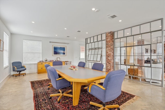 dining area with concrete flooring, baseboards, visible vents, and recessed lighting