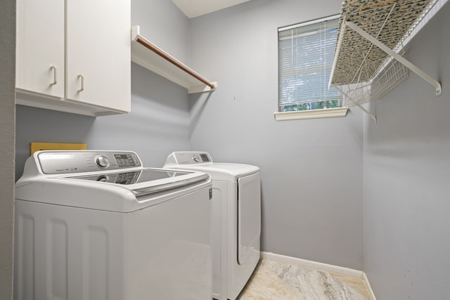6307 Shoreview Ct, Humble, TX 77346 - laundry area with baseboards, cabinet space, and separate washer and dryer
