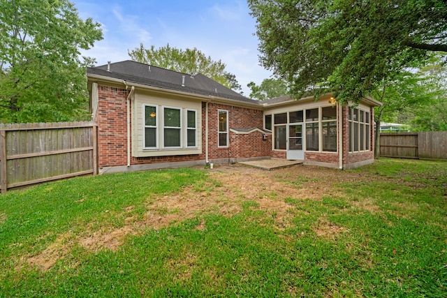 6307 Shoreview Ct, Humble, TX 77346 - back of property with a lawn, a sunroom, a fenced backyard, and brick siding