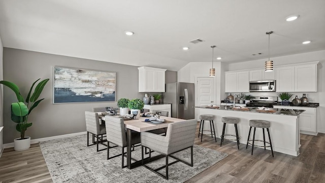 13913 Bahia Bay, Texas City, TX 77591 - dining area with wood finished floors, recessed lighting, and baseboards