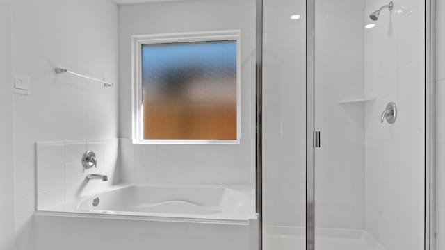 13913 Bahia Bay, Texas City, TX 77591 - full bath with plenty of natural light, a stall shower, and a bath