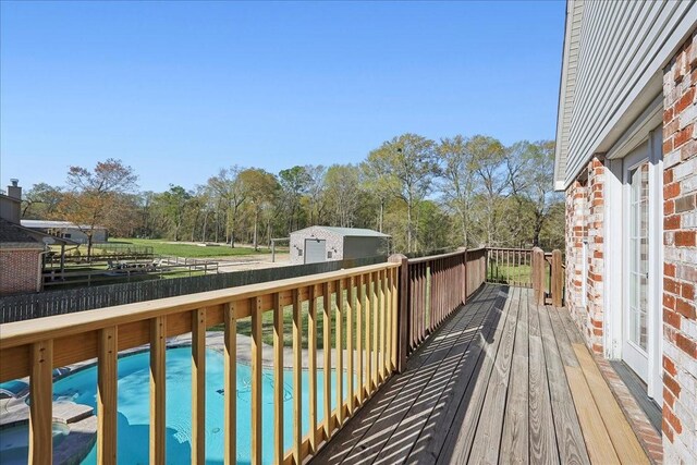 7403 S Park Rd, Lumberton, TX 77657 - deck featuring a fenced in pool and a garage