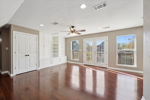 7403 S Park Rd, Lumberton, TX 77657 - unfurnished living room with visible vents, ceiling fan, baseboards, hardwood / wood-style floors, and a textured ceiling