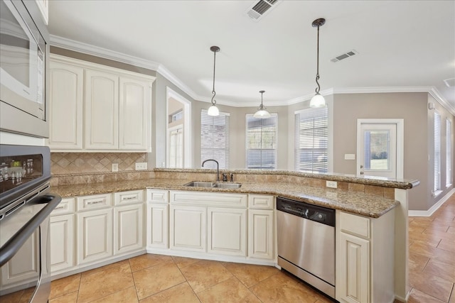 7403 S Park Rd, Lumberton, TX 77657 - kitchen featuring a sink, visible vents, plenty of natural light, and appliances with stainless steel finishes