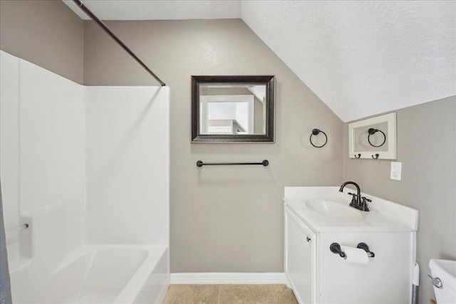 7403 S Park Rd, Lumberton, TX 77657 - bathroom with vanity, baseboards, vaulted ceiling, a textured ceiling, and toilet