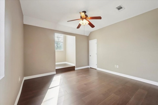7403 S Park Rd, Lumberton, TX 77657 - spare room featuring dark wood-type flooring, a ceiling fan, visible vents, and baseboards