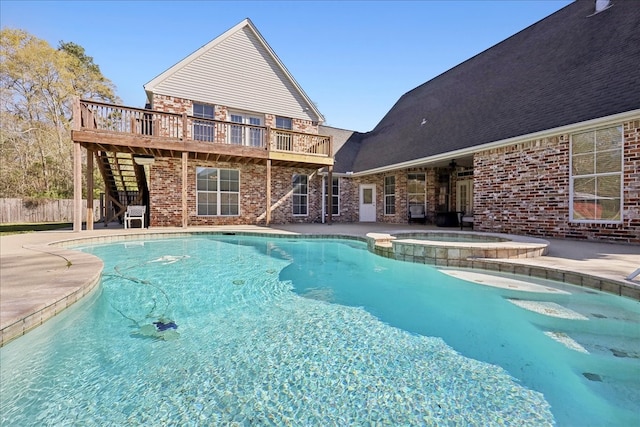 7403 S Park Rd, Lumberton, TX 77657 - view of pool featuring a patio area, stairway, a pool with connected hot tub, and a deck