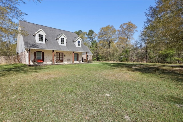7403 S Park Rd, Lumberton, TX 77657 - cape cod-style house featuring a front lawn and a porch