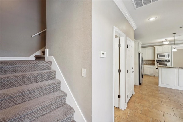 7403 S Park Rd, Lumberton, TX 77657 - stairs with visible vents, recessed lighting, and crown molding