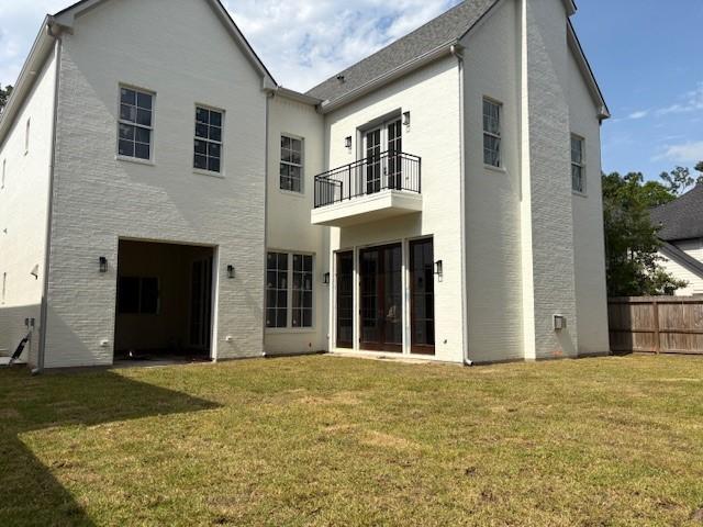 7203 Tickner St, Houston, TX 77055 - rear view of house featuring a balcony and stucco siding