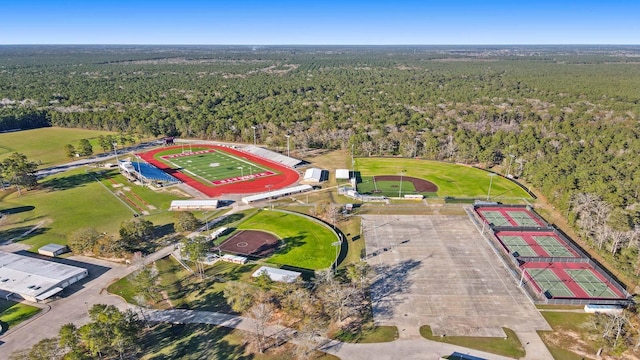 birds eye view of property featuring a forest view