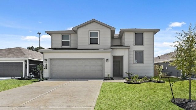 traditional-style house with concrete driveway, a front yard, and an attached garage