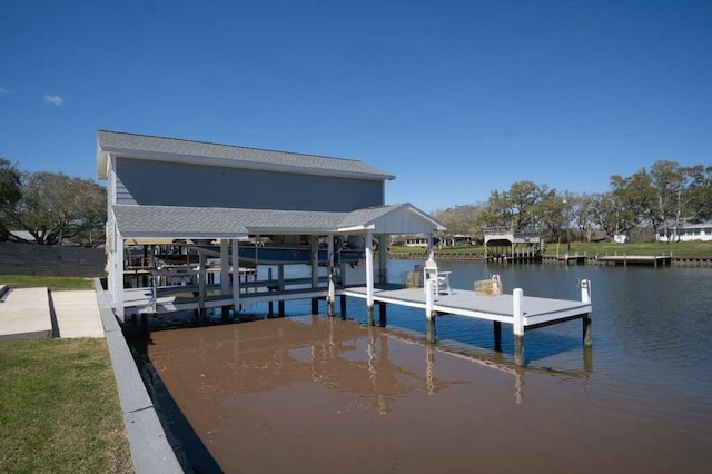 view of dock with boat lift and a water view
