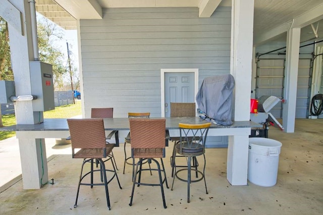 view of patio featuring outdoor dining area