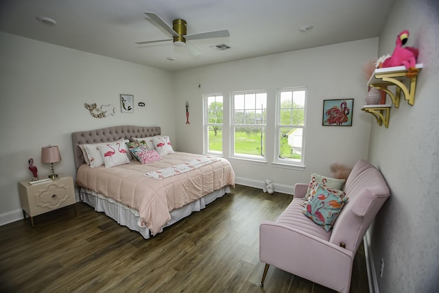 bedroom with visible vents, baseboards, a ceiling fan, and dark wood-style flooring