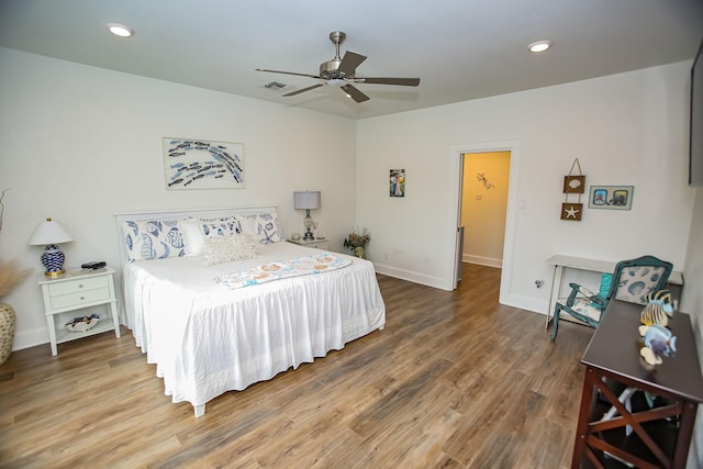 bedroom with recessed lighting, baseboards, wood finished floors, and a ceiling fan