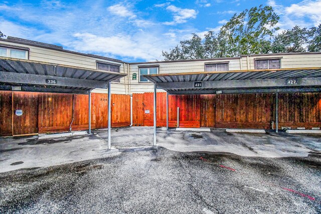 11525 Burdine St Unit 421, Houston, TX 77035 - covered parking lot featuring fence