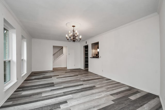 11525 Burdine St Unit 421, Houston, TX 77035 - spare room featuring a chandelier, stairs, crown molding, and wood finished floors