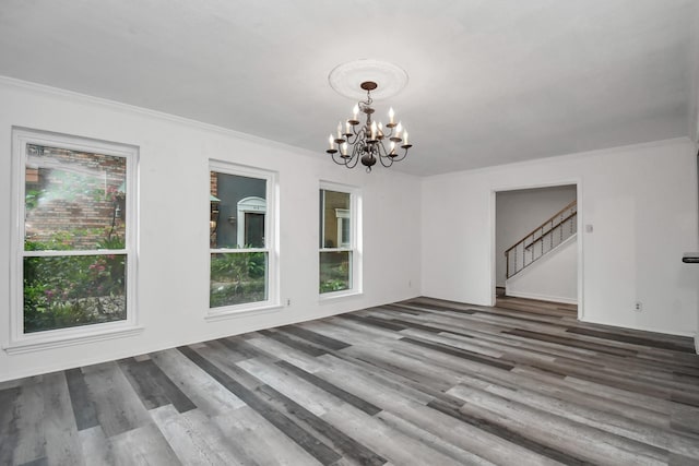 11525 Burdine St Unit 421, Houston, TX 77035 - interior space with a notable chandelier, plenty of natural light, wood finished floors, and ornamental molding