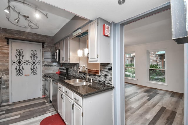 11525 Burdine St Unit 421, Houston, TX 77035 - kitchen with white cabinets, tasteful backsplash, stainless steel appliances, and a sink
