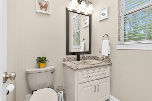 4106 Tee Tree Ct, Spring, TX 77386 - bathroom with toilet, vanity, and baseboards