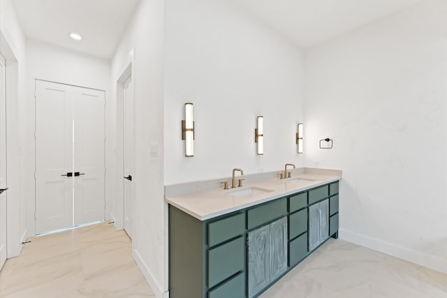 2932 Michaux St, Houston, TX 77009 - bathroom with marble finish flooring, baseboards, double vanity, and recessed lighting
