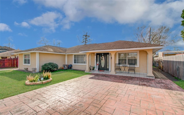 1421 Glenmore Forest St, Houston, TX 77055 - view of front of property featuring stucco siding, a front lawn, and fence
