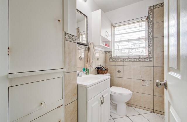 1421 Glenmore Forest St, Houston, TX 77055 - half bath featuring toilet, tile walls, vanity, and tile patterned flooring