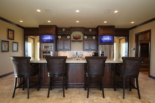 bar featuring decorative backsplash, wet bar, appliances with stainless steel finishes, and ornamental molding