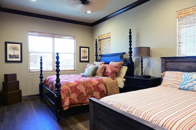 bedroom featuring baseboards, wood-type flooring, a ceiling fan, and crown molding