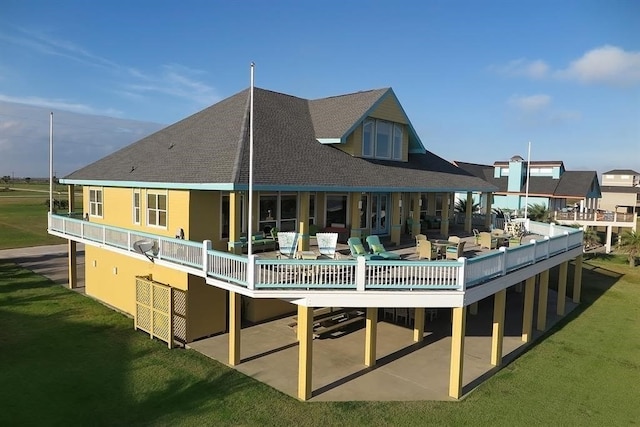 back of house with a patio and a yard