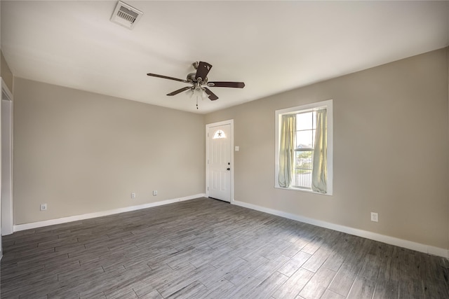1719 Lombardy St, Houston, TX 77023 - spare room with baseboards, dark wood finished floors, and a ceiling fan