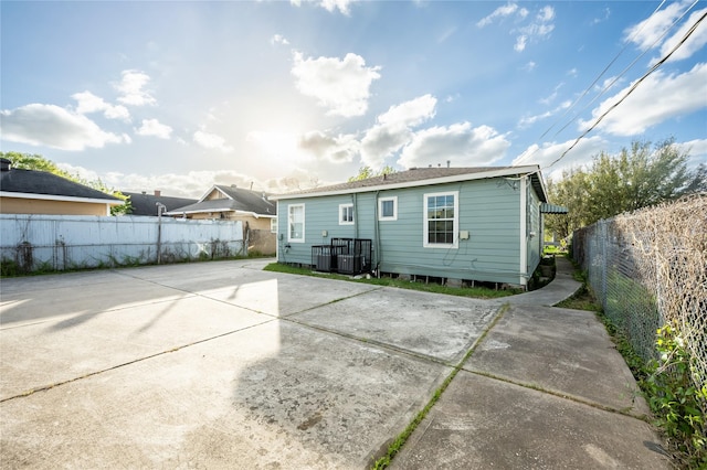 1719 Lombardy St, Houston, TX 77023 - rear view of house with a patio area, a fenced backyard, and central AC