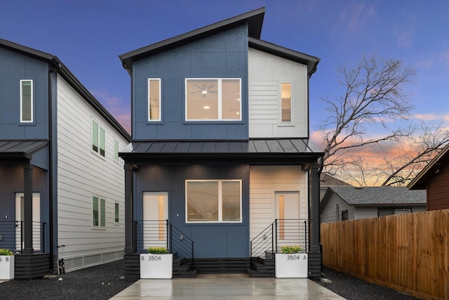 3504 Delhi St B, Unit A, Houston, TX 77022 - rear view of property with a standing seam roof, fence, and metal roof