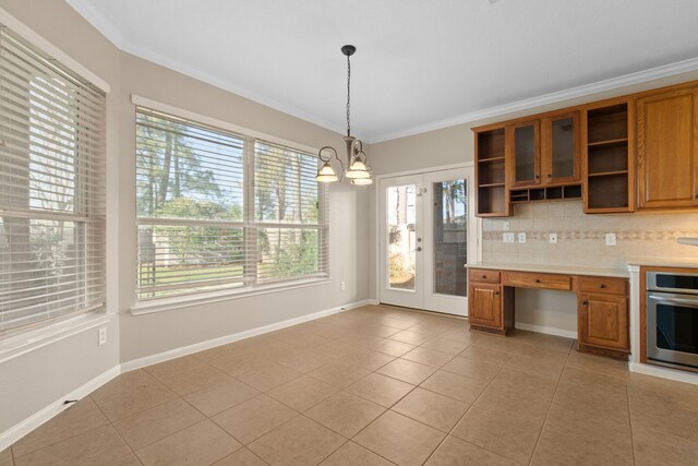 kitchen featuring an inviting chandelier, brown cabinets, oven, and open shelves
