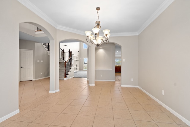 spare room with light tile patterned flooring, stairway, a chandelier, baseboards, and arched walkways