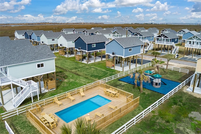 1072 Johnson Rd, Gilchrist, TX 77617 - aerial perspective of suburban area with a pool