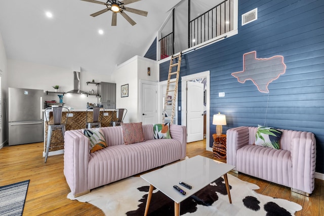1072 Johnson Rd, Gilchrist, TX 77617 - living room with high vaulted ceiling, ceiling fan, and light wood finished floors