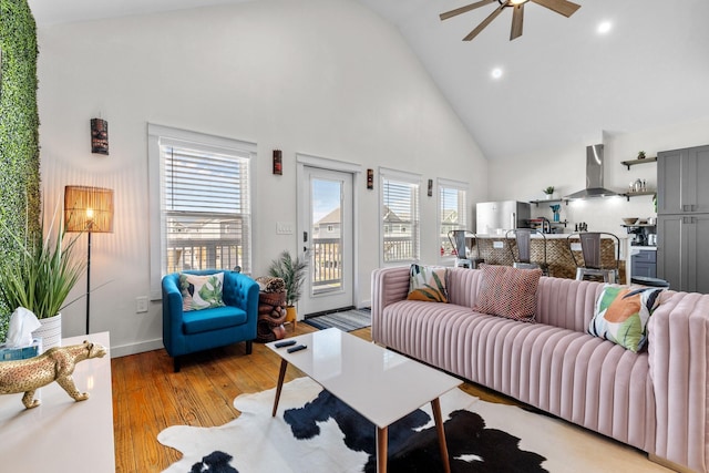 1072 Johnson Rd, Gilchrist, TX 77617 - living room featuring high vaulted ceiling, a ceiling fan, light wood finished floors, recessed lighting, and baseboards