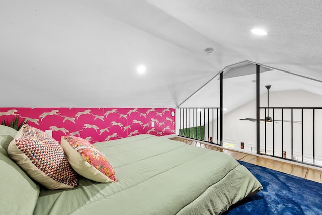 1072 Johnson Rd, Gilchrist, TX 77617 - bedroom featuring hardwood / wood-style floors, recessed lighting, and vaulted ceiling