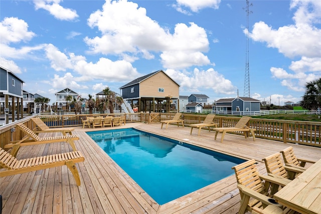 1072 Johnson Rd, Gilchrist, TX 77617 - outdoor pool featuring a wooden deck