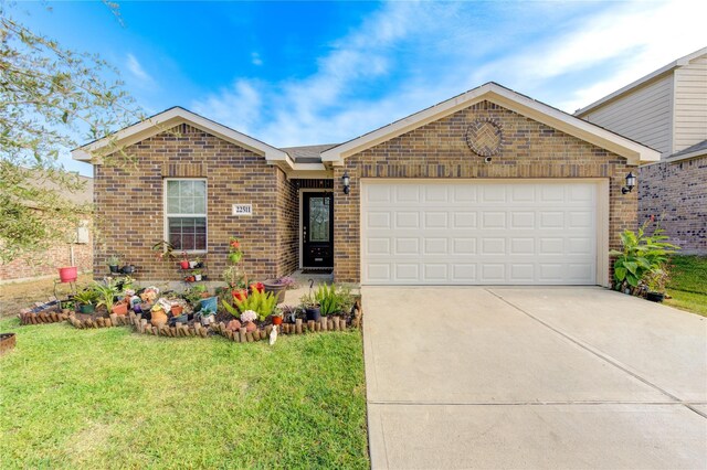 ranch-style home featuring a front yard, brick siding, concrete driveway, and an attached garage