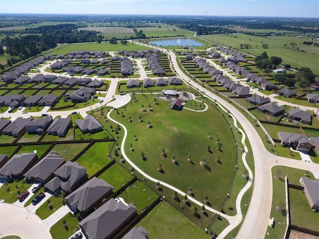 birds eye view of property featuring a residential view and a water view