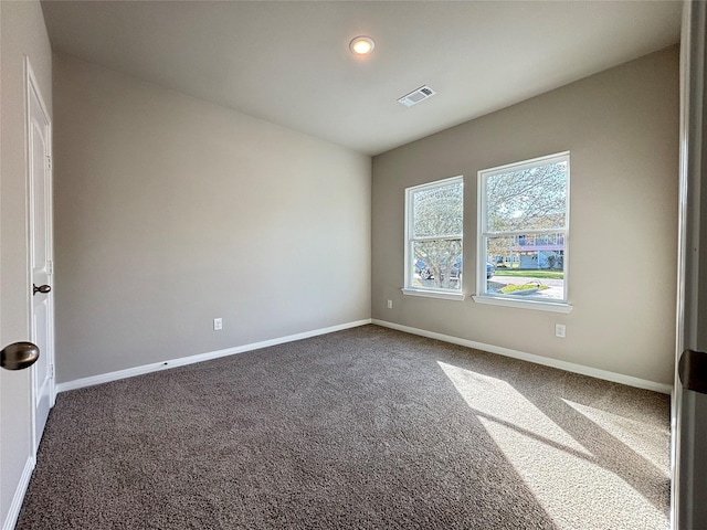 unfurnished bedroom featuring carpet flooring, baseboards, and visible vents