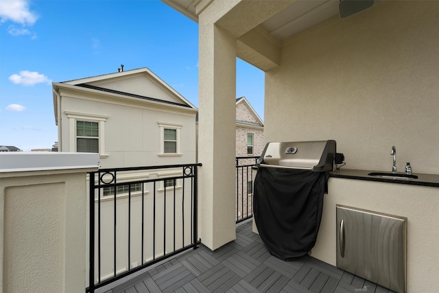 balcony featuring grilling area and a sink